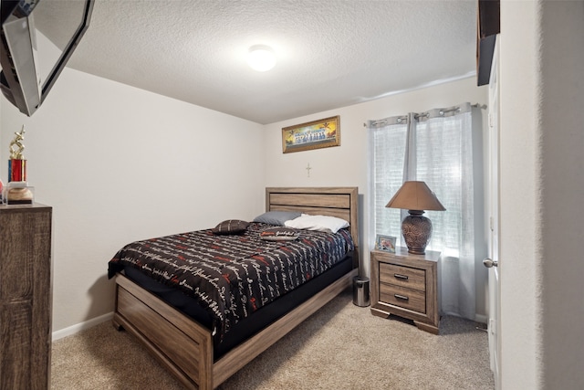 carpeted bedroom with a textured ceiling