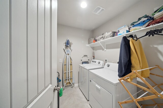 washroom with washing machine and clothes dryer