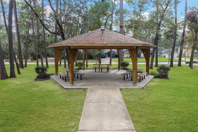 view of property's community featuring a yard and a gazebo