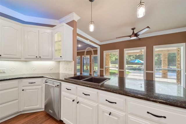 kitchen with white cabinets, crown molding, pendant lighting, and dishwasher