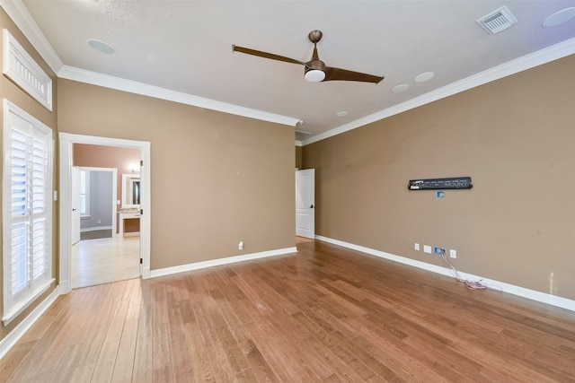 unfurnished room with light hardwood / wood-style floors, ceiling fan, and ornamental molding