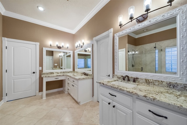 bathroom featuring a shower with shower door, vanity, tile patterned floors, and crown molding