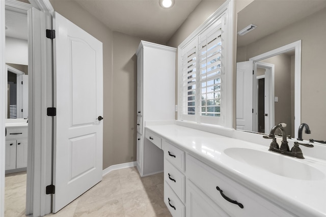 bathroom with vanity and tile patterned floors