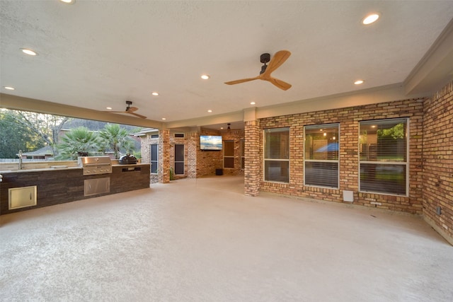 view of patio / terrace featuring grilling area, area for grilling, and ceiling fan