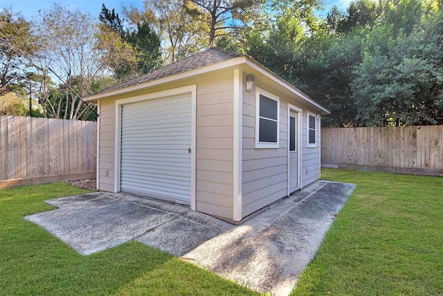 view of outbuilding featuring a lawn