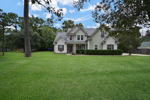 craftsman house featuring a front lawn