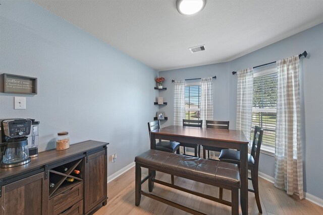 dining area with light hardwood / wood-style flooring