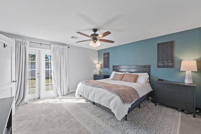 carpeted bedroom with ceiling fan and access to exterior