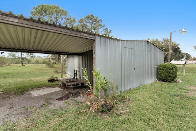 view of outdoor structure with a yard