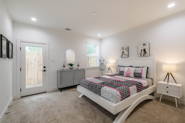 carpeted bedroom featuring access to outside