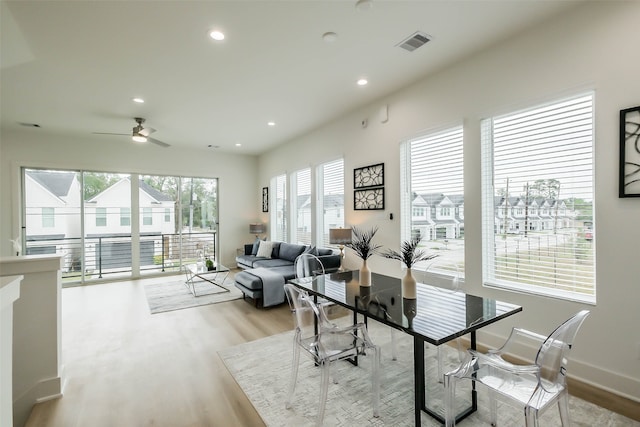 dining space featuring light hardwood / wood-style floors and ceiling fan