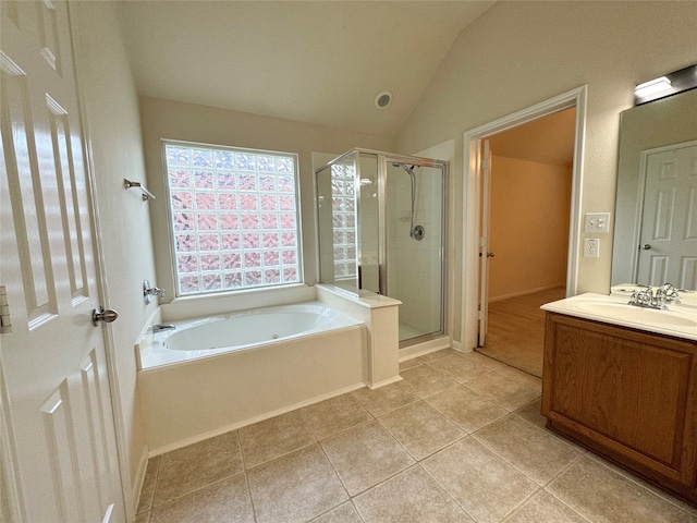 full bath featuring lofted ceiling, a garden tub, vanity, a shower stall, and tile patterned floors