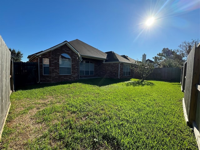 view of yard with a fenced backyard