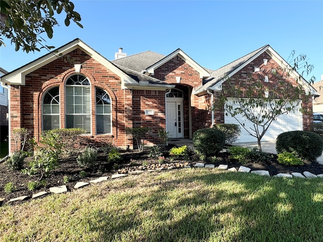 single story home with brick siding, roof with shingles, a chimney, an attached garage, and a front yard