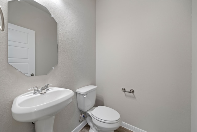 bathroom with sink and toilet