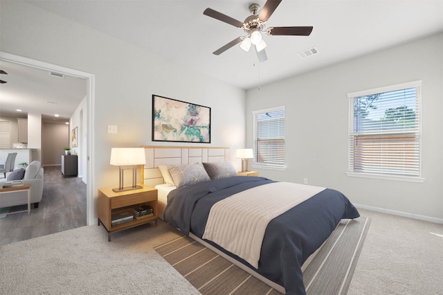 bedroom featuring wood-type flooring and ceiling fan