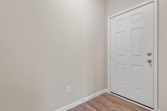 511 Emerald Thicket Ln, Huffman, TX 77336 - doorway featuring wood finished floors and baseboards