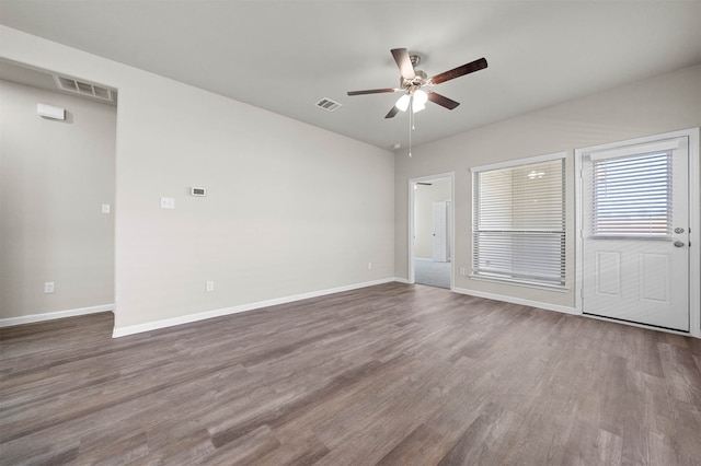 empty room featuring hardwood / wood-style flooring and ceiling fan