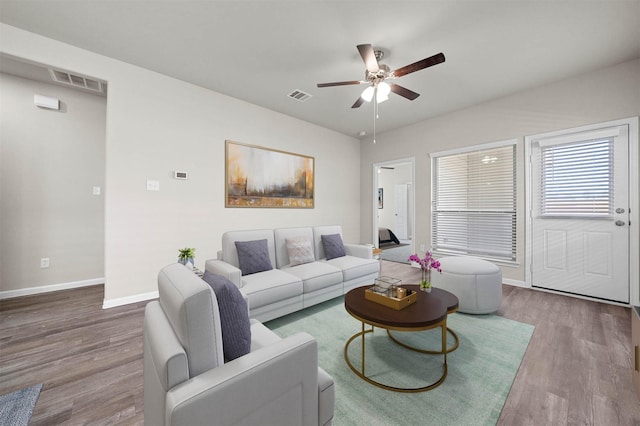511 Emerald Thicket Ln, Huffman, TX 77336 - living room with wood finished floors, a ceiling fan, and baseboards