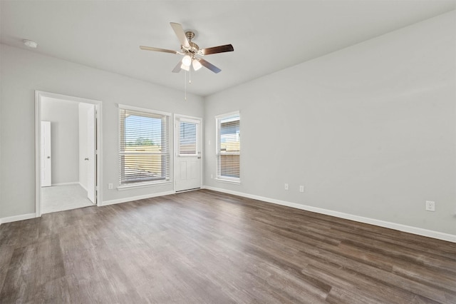 511 Emerald Thicket Ln, Huffman, TX 77336 - empty room featuring ceiling fan, a smoke detector, wood finished floors, and baseboards