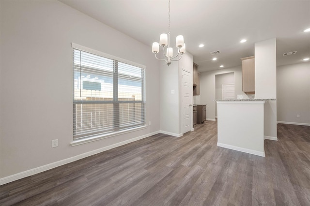511 Emerald Thicket Ln, Huffman, TX 77336 - kitchen with a chandelier, dark wood finished floors, baseboards, recessed lighting, and light stone counters