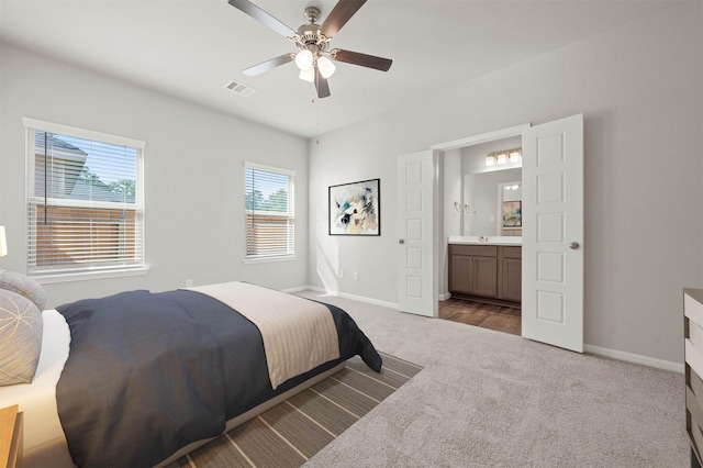 511 Emerald Thicket Ln, Huffman, TX 77336 - bedroom featuring carpet, baseboards, connected bathroom, and a ceiling fan