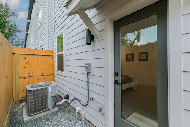 exterior details with cooling unit and wooden walls