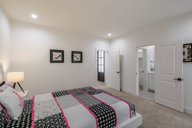 carpeted bedroom with ensuite bathroom