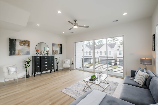 living room with ceiling fan and light hardwood / wood-style floors