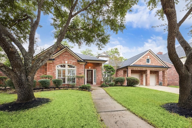 view of front of house with a garage and a front lawn