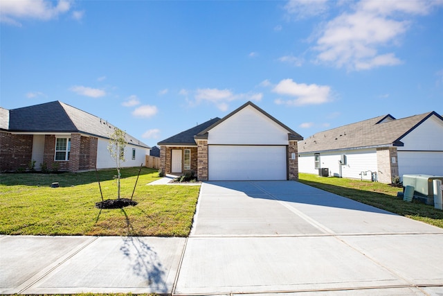 view of front facade with a garage, cooling unit, and a front lawn