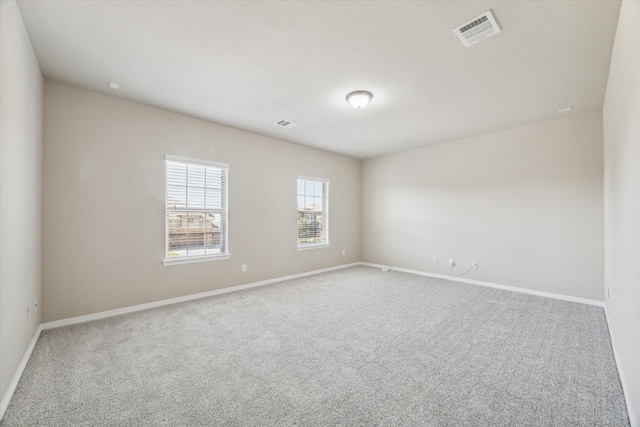 unfurnished room with carpet flooring