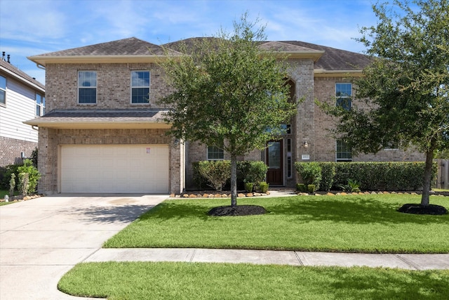 view of front facade with a garage and a front yard