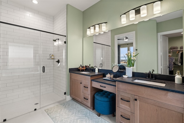 bathroom featuring tile patterned floors, vanity, ceiling fan, and an enclosed shower