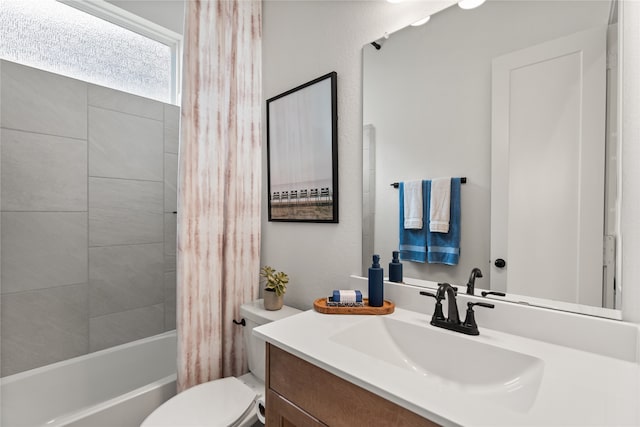 full bathroom with shower / tub combo, vanity, and toilet