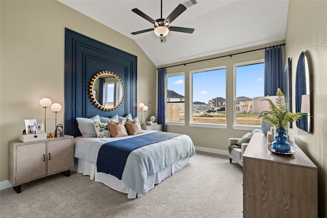 carpeted bedroom featuring ceiling fan and vaulted ceiling