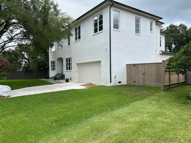 3011 Deal St, Houston, TX 77025 - back of property with a garage, driveway, and stucco siding