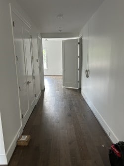 3011 Deal St, Houston, TX 77025 - corridor featuring dark wood-style floors and baseboards