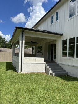3011 Deal St, Houston, TX 77025 - back of house with board and batten siding and ceiling fan