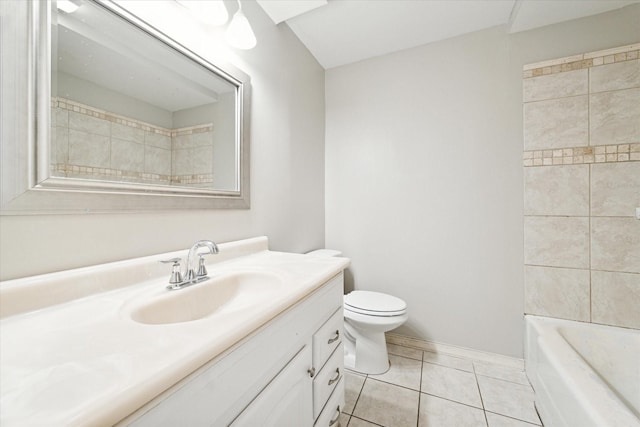 bathroom featuring tile patterned flooring, vanity, and toilet