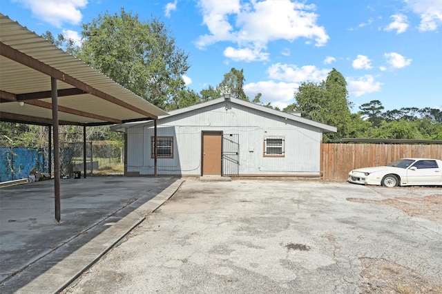 view of outbuilding featuring a carport