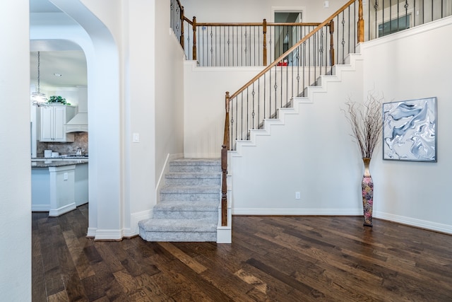 staircase with wood-type flooring