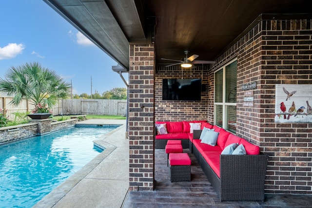 view of swimming pool with ceiling fan and an outdoor living space