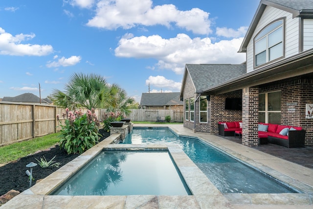 view of swimming pool with an outdoor living space and a patio area