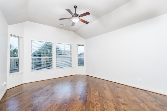 empty room with hardwood / wood-style flooring, lofted ceiling, and ceiling fan