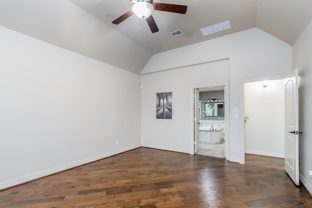 unfurnished room featuring ceiling fan, dark wood-type flooring, and lofted ceiling