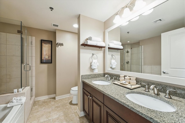 bathroom featuring tile patterned flooring, toilet, an enclosed shower, and vanity