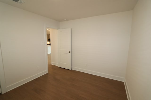 9819 Robard Ridge Ct, Montgomery, TX 77316 - empty room featuring dark wood-style flooring, baseboards, and visible vents