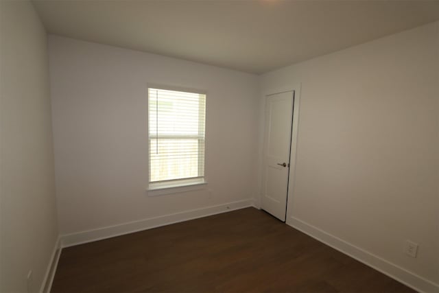9819 Robard Ridge Ct, Montgomery, TX 77316 - spare room with dark wood-style flooring and baseboards