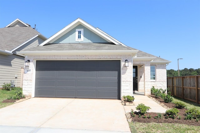 9819 Robard Ridge Ct, Montgomery, TX 77316 - view of front facade with concrete driveway, roof with shingles, brick siding, a garage, and fence